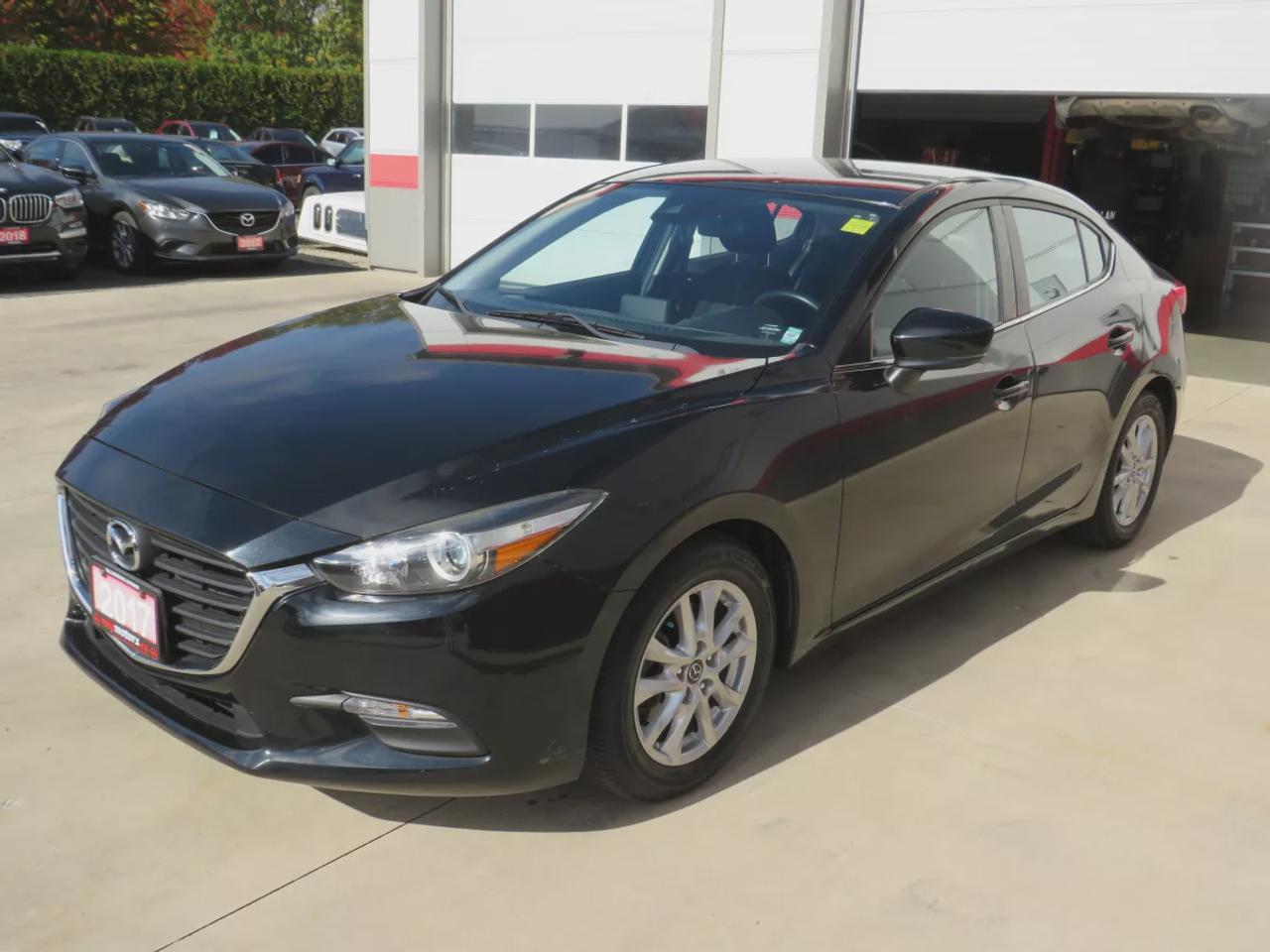 2017 Mazda MAZDA3 GS | LOW KMS | FWD | Automatic | Alloy Wheels | Heated Seats | Heated Steering Wheel | Air Conditioning | Touchscreen Display | Bluetooth | Back-Up Camera | Blind Spot Monitor | Cruise Control | Rain-Sensing Wipers |  Heated Power Mirrors Photo