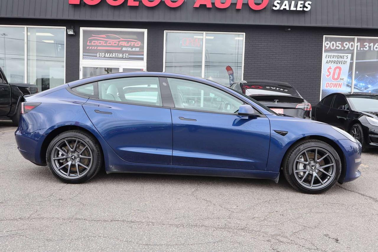 2023 Tesla Model 3 Standard Range Plus White Interior Photo