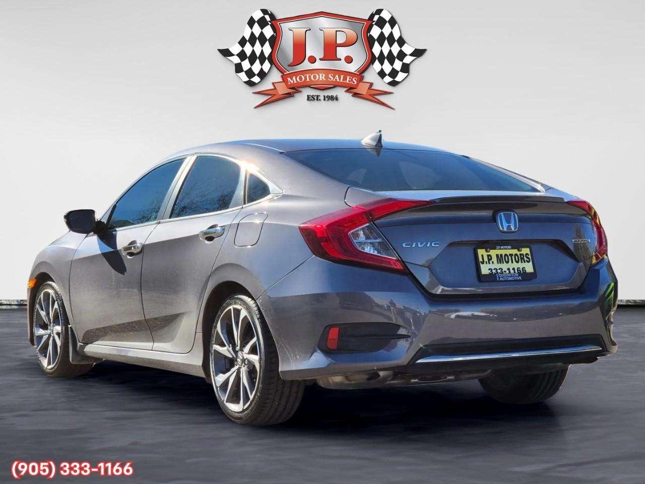 2019 Honda Civic Touring Apple CarPlay & Android Auto • Power Sunroof • Leather Seating • Built-In Navigation System • Remote Start System Photo4