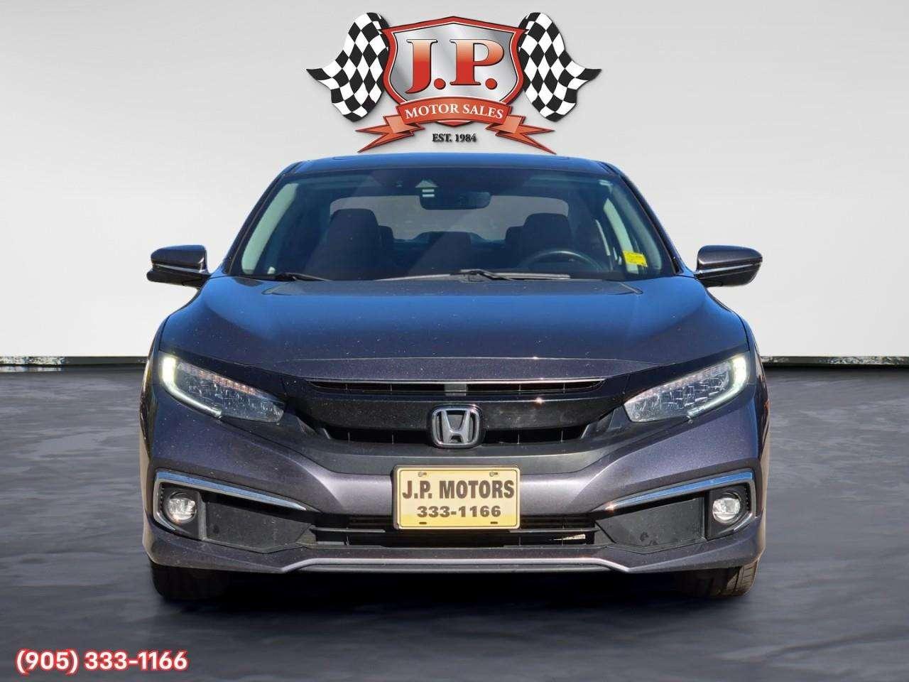 2019 Honda Civic Touring Apple CarPlay & Android Auto • Power Sunroof • Leather Seating • Built-In Navigation System • Remote Start System Photo1