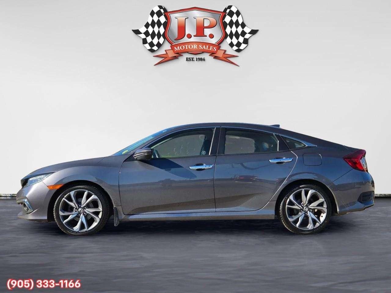 2019 Honda Civic Touring Apple CarPlay & Android Auto • Power Sunroof • Leather Seating • Built-In Navigation System • Remote Start System Photo