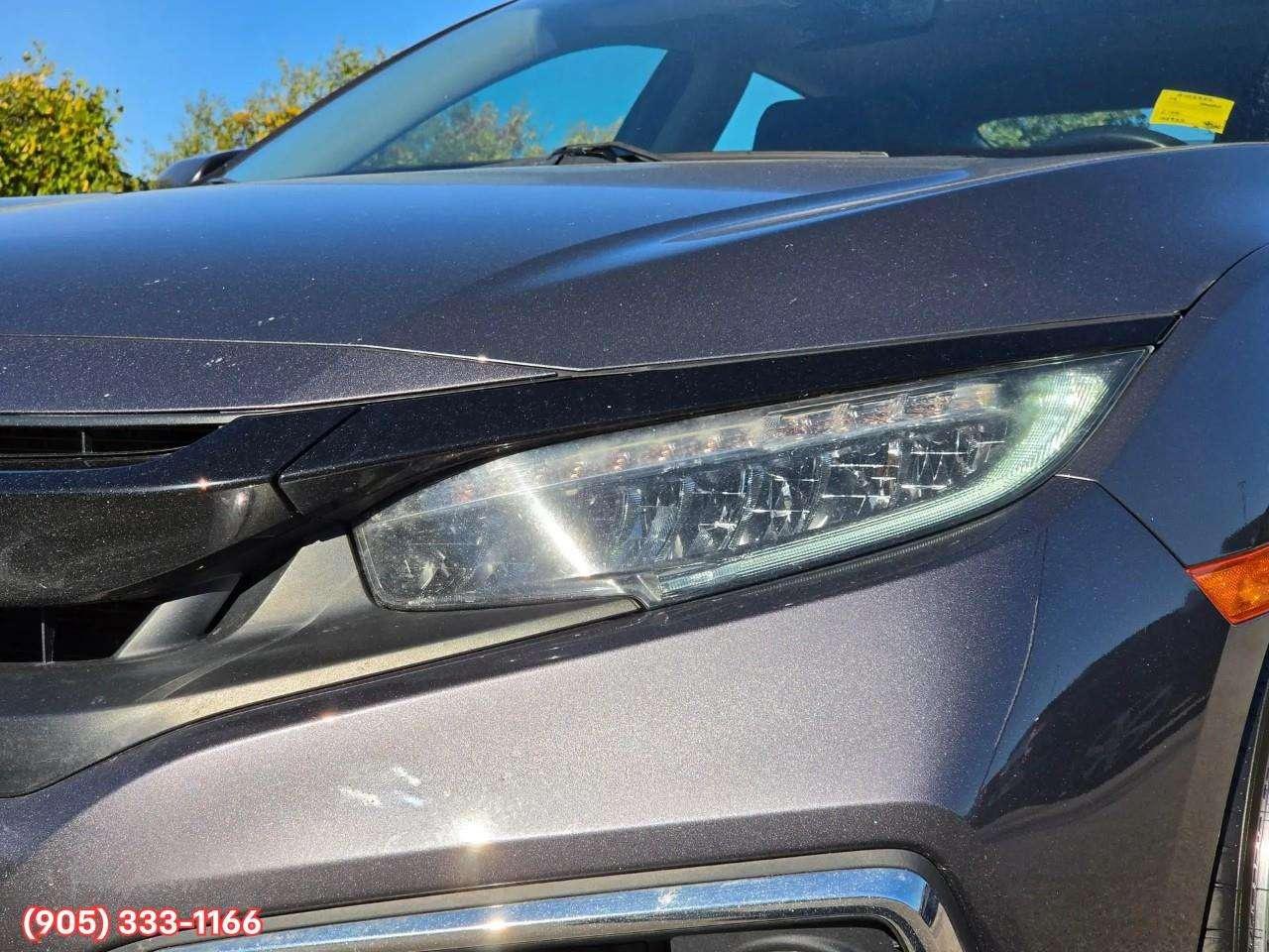 2019 Honda Civic Touring Apple CarPlay & Android Auto • Power Sunroof • Leather Seating • Built-In Navigation System • Remote Start System Photo