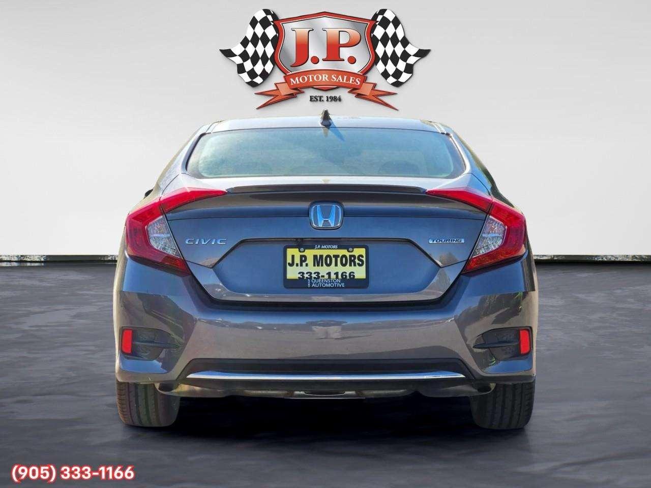 2019 Honda Civic Touring Apple CarPlay & Android Auto • Power Sunroof • Leather Seating • Built-In Navigation System • Remote Start System Photo
