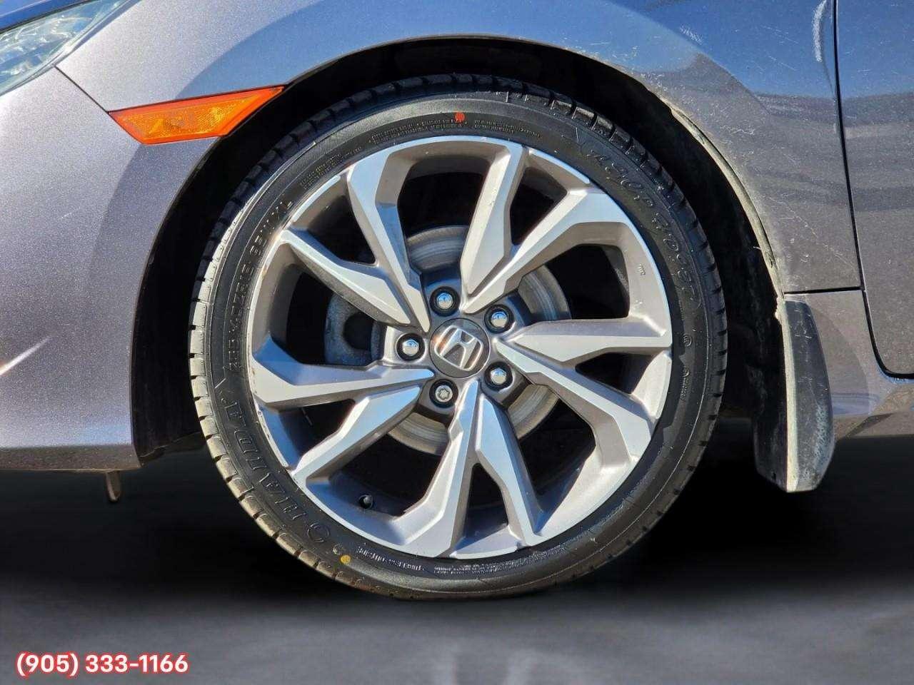 2019 Honda Civic Touring Apple CarPlay & Android Auto • Power Sunroof • Leather Seating • Built-In Navigation System • Remote Start System Photo