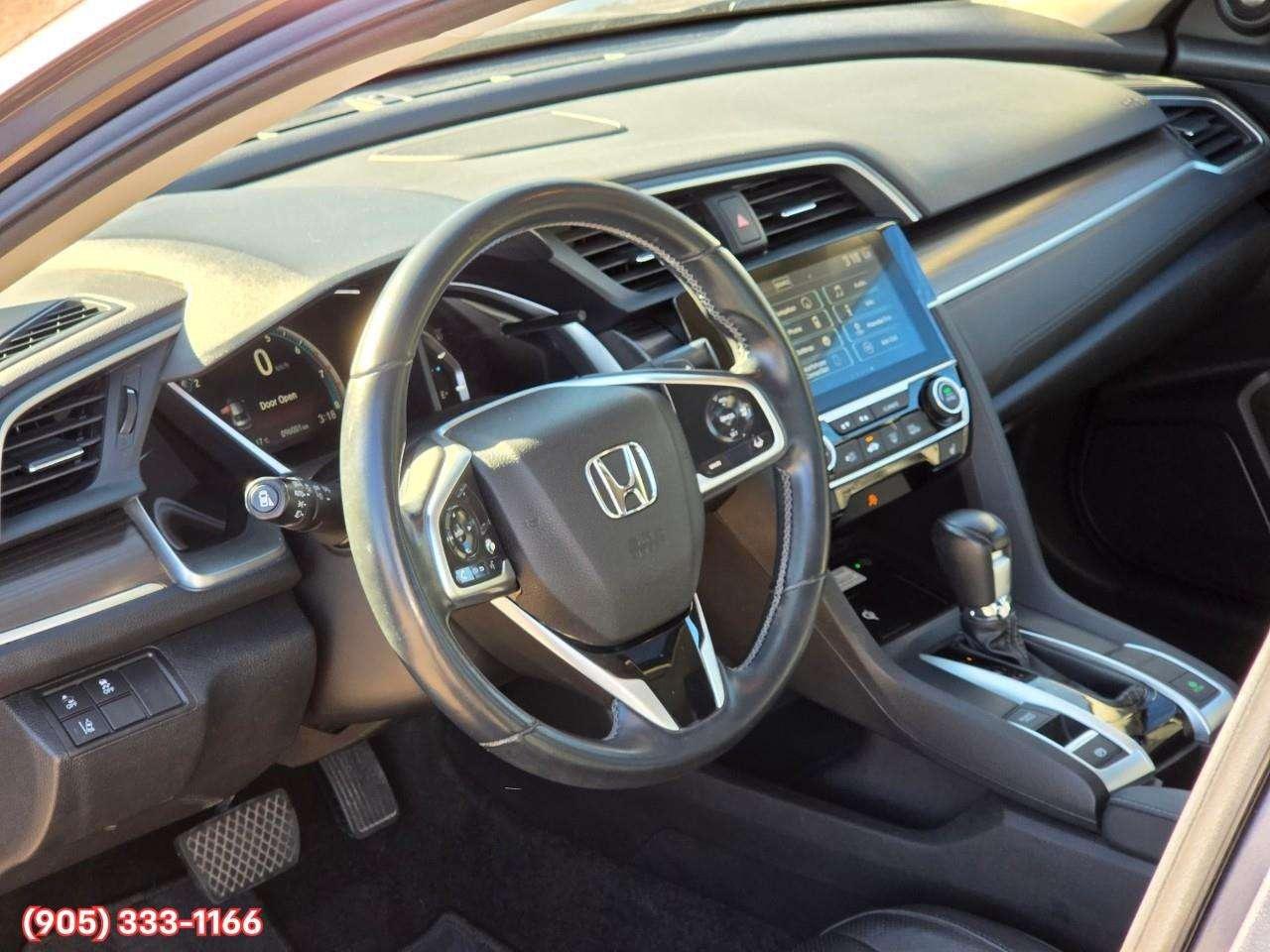 2019 Honda Civic Touring Apple CarPlay & Android Auto • Power Sunroof • Leather Seating • Built-In Navigation System • Remote Start System Photo