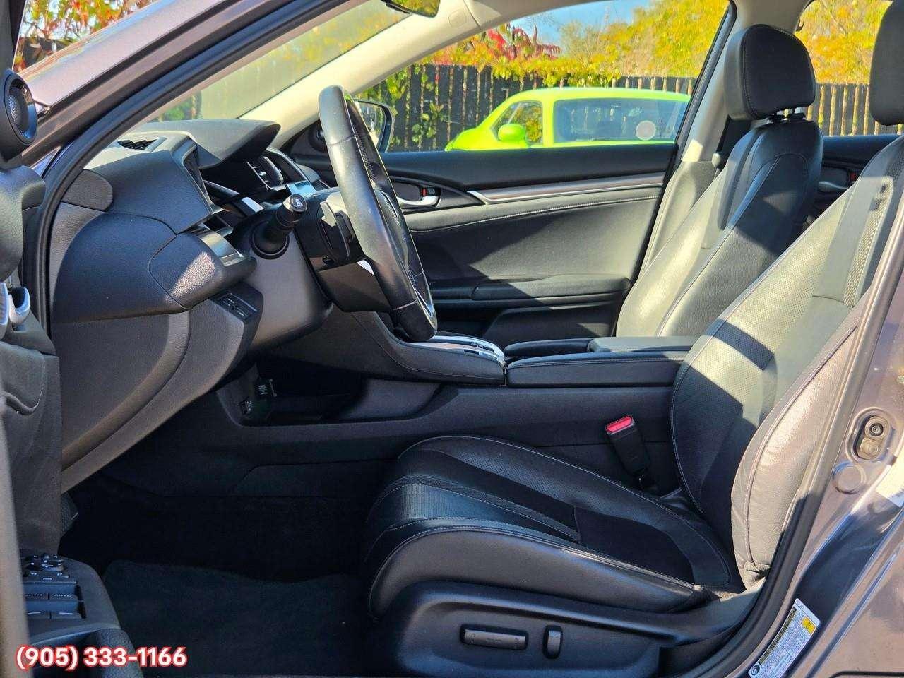 2019 Honda Civic Touring Apple CarPlay & Android Auto • Power Sunroof • Leather Seating • Built-In Navigation System • Remote Start System Photo