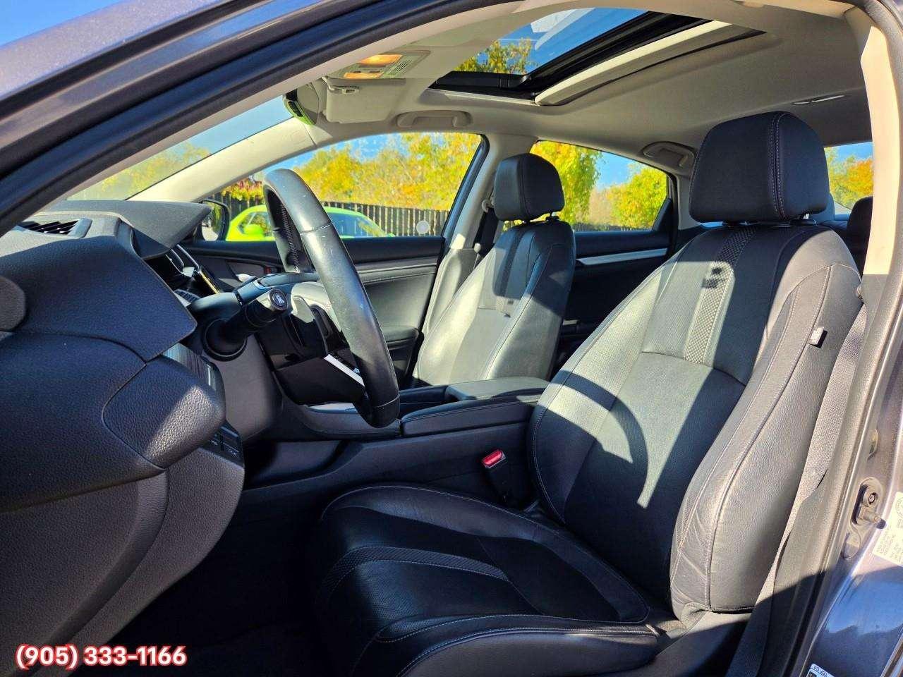 2019 Honda Civic Touring Apple CarPlay & Android Auto • Power Sunroof • Leather Seating • Built-In Navigation System • Remote Start System Photo