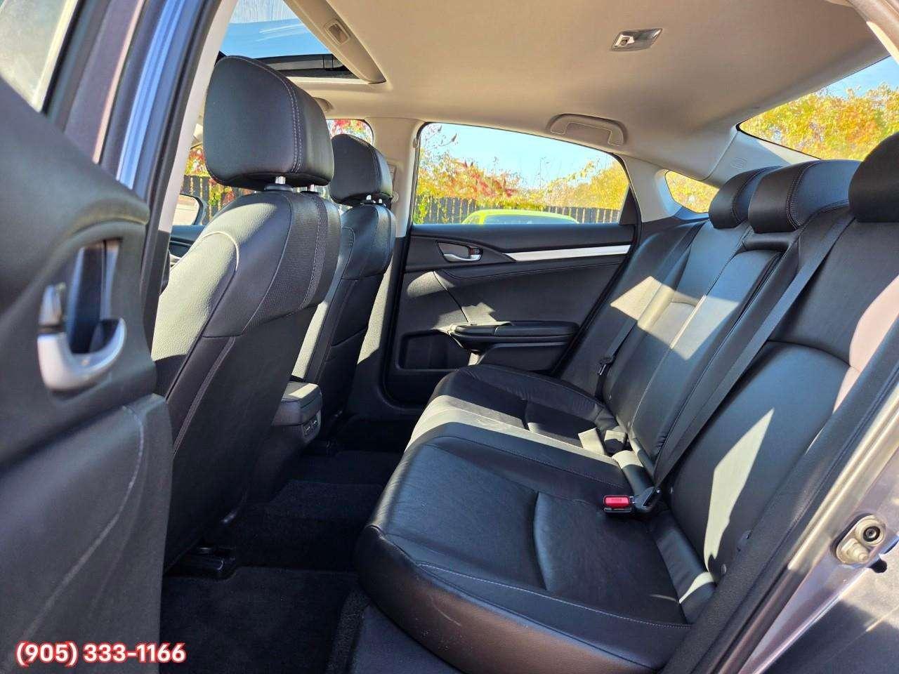 2019 Honda Civic Touring Apple CarPlay & Android Auto • Power Sunroof • Leather Seating • Built-In Navigation System • Remote Start System Photo