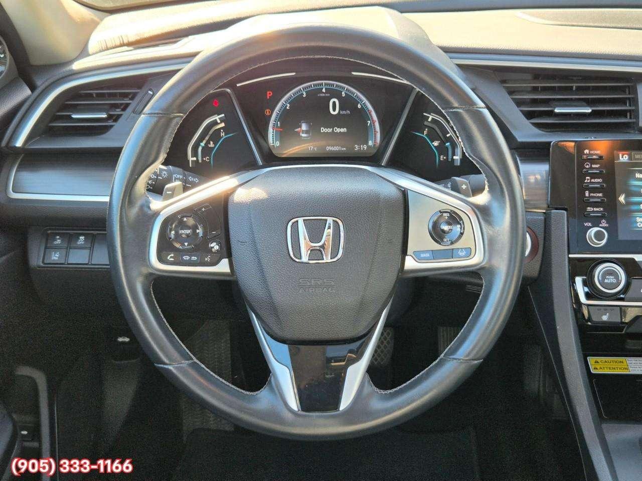 2019 Honda Civic Touring Apple CarPlay & Android Auto • Power Sunroof • Leather Seating • Built-In Navigation System • Remote Start System Photo