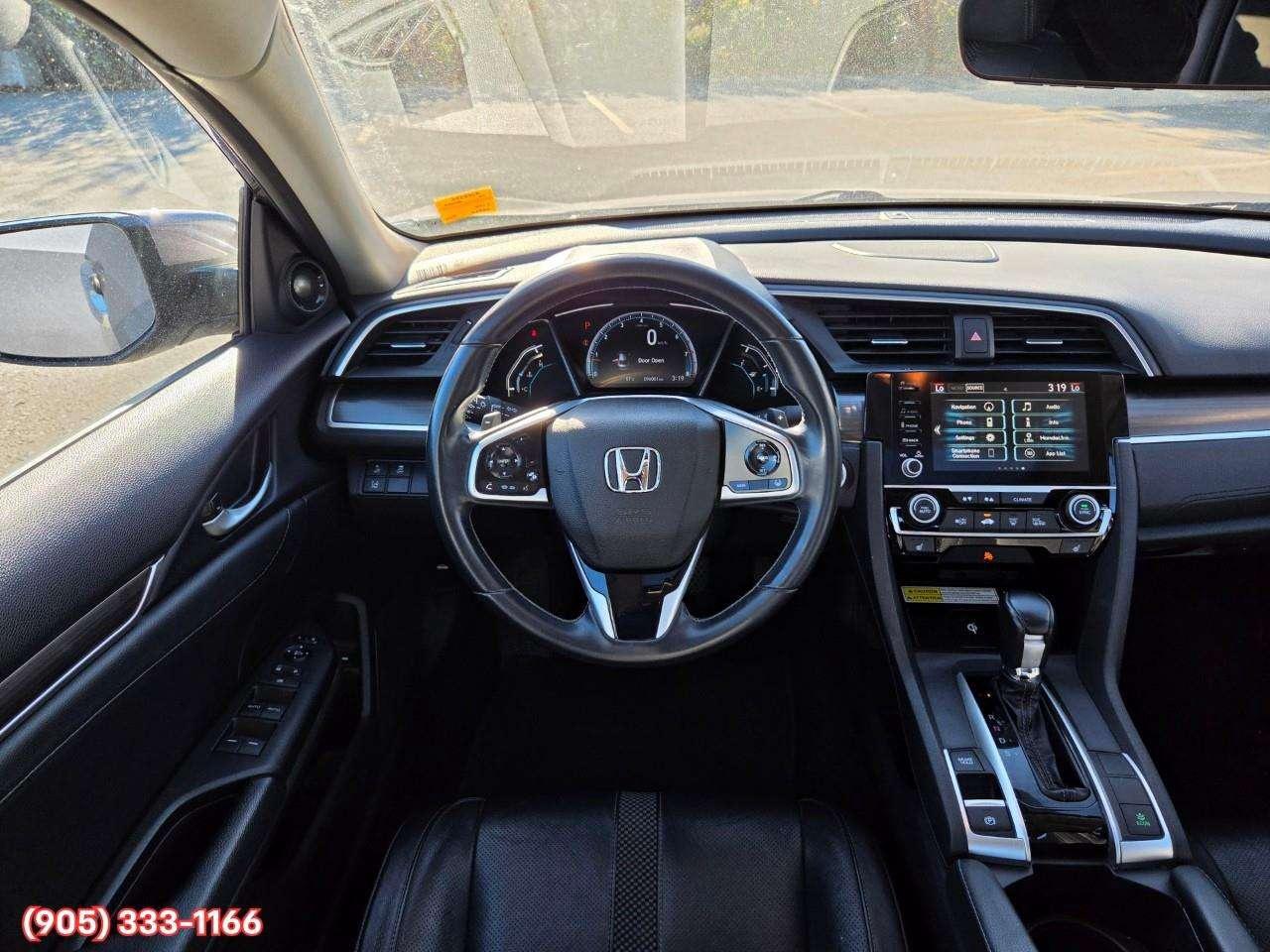 2019 Honda Civic Touring Apple CarPlay & Android Auto • Power Sunroof • Leather Seating • Built-In Navigation System • Remote Start System Photo
