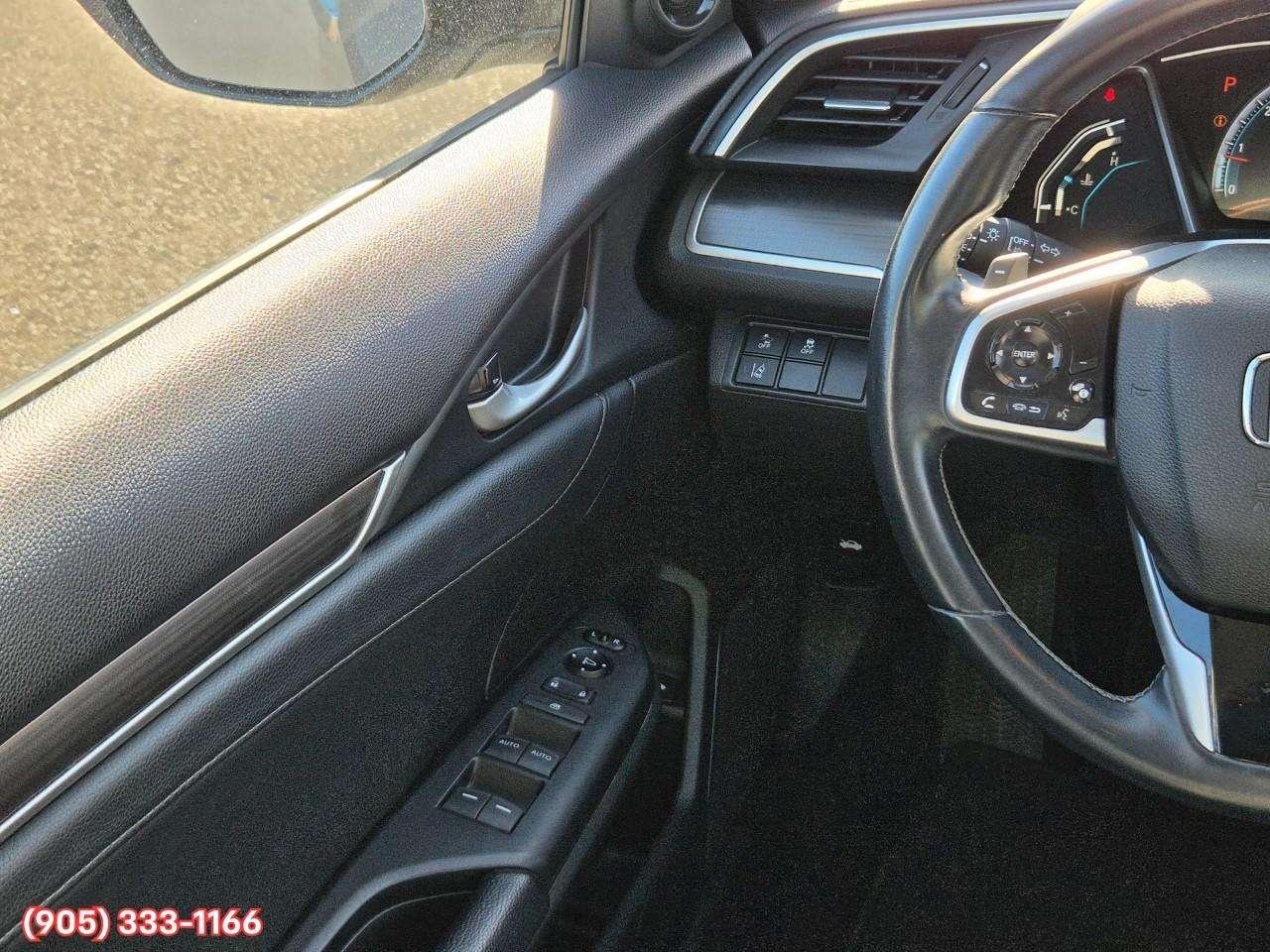 2019 Honda Civic Touring Apple CarPlay & Android Auto • Power Sunroof • Leather Seating • Built-In Navigation System • Remote Start System Photo