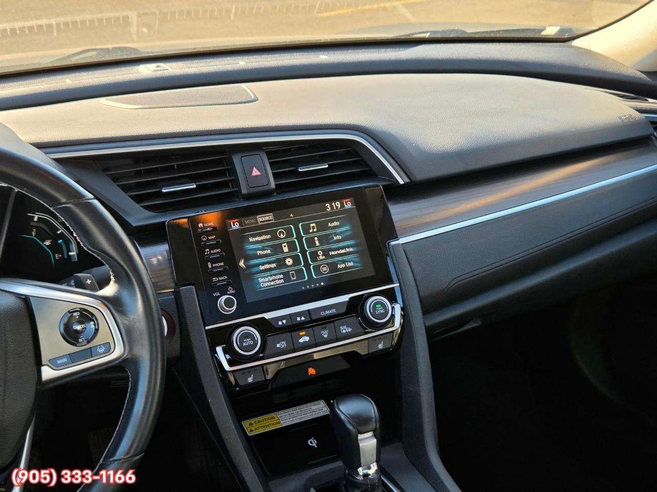2019 Honda Civic Touring Apple CarPlay & Android Auto • Power Sunroof • Leather Seating • Built-In Navigation System • Remote Start System Photo