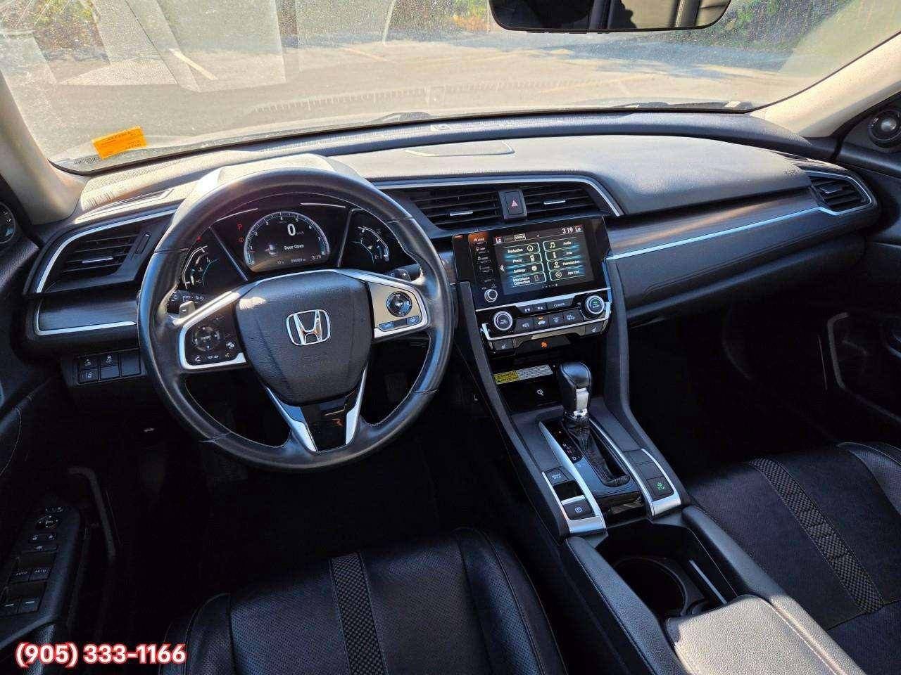 2019 Honda Civic Touring Apple CarPlay & Android Auto • Power Sunroof • Leather Seating • Built-In Navigation System • Remote Start System Photo