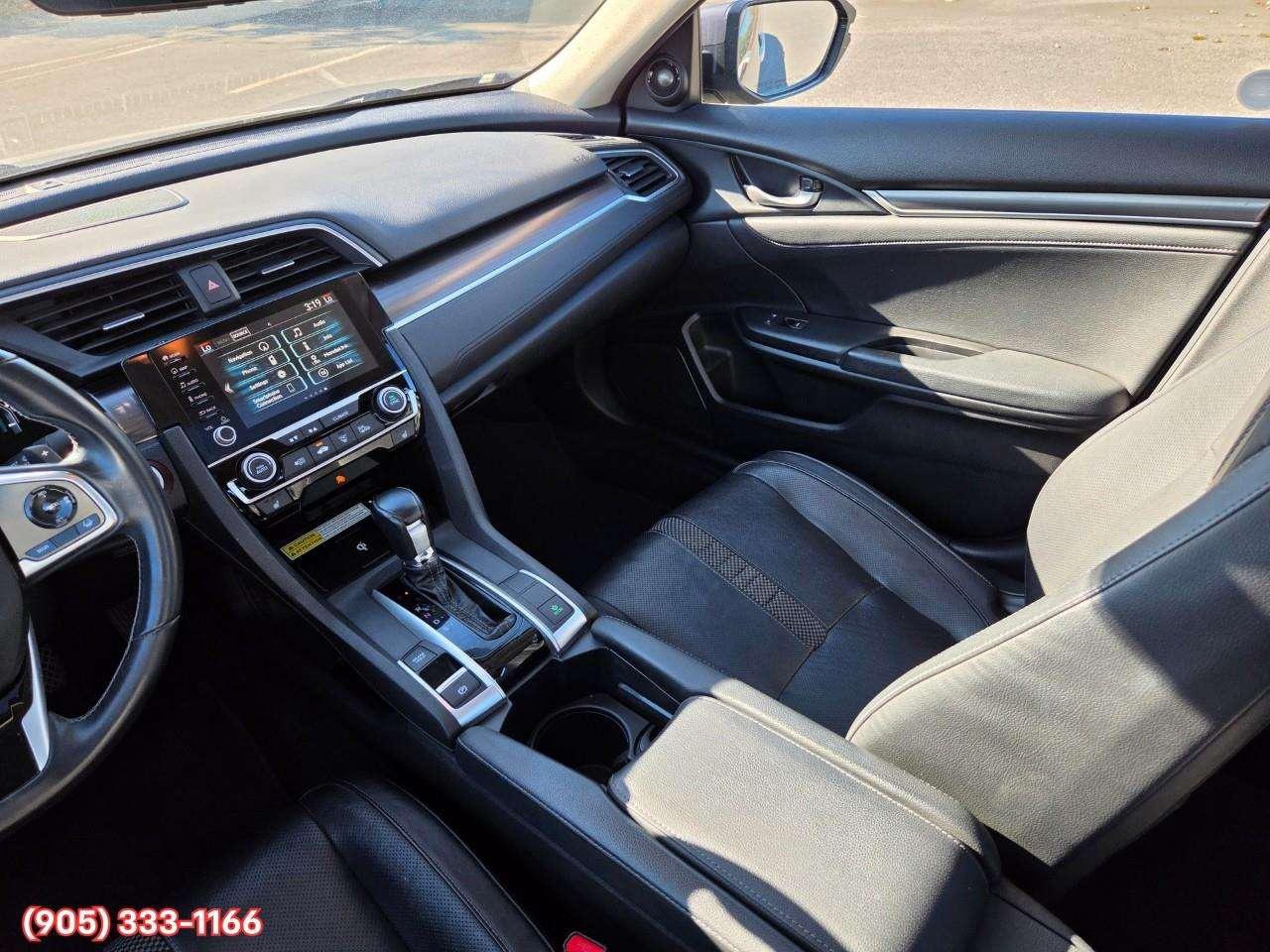 2019 Honda Civic Touring Apple CarPlay & Android Auto • Power Sunroof • Leather Seating • Built-In Navigation System • Remote Start System Photo