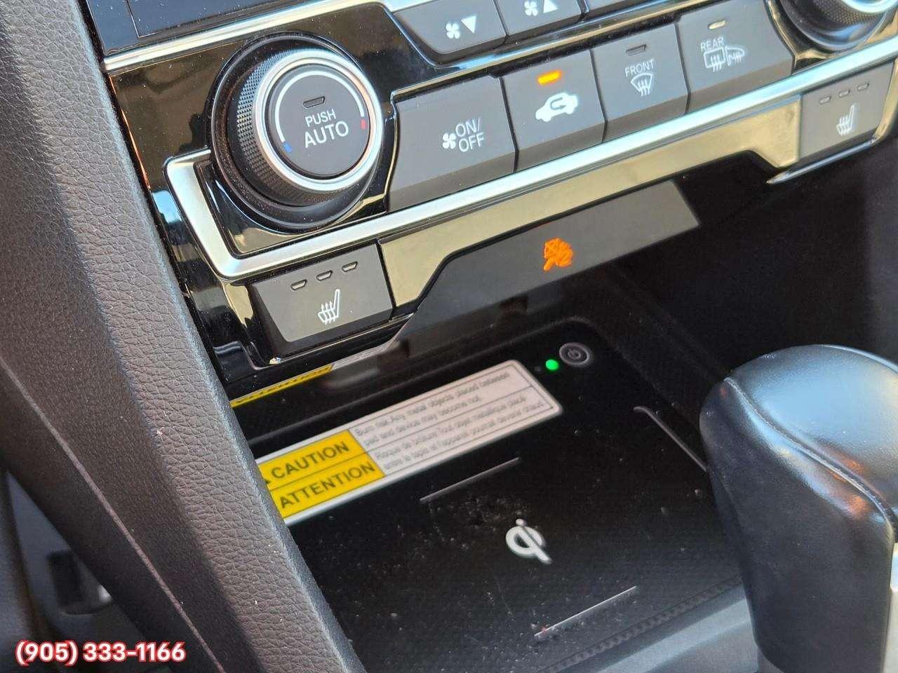 2019 Honda Civic Touring Apple CarPlay & Android Auto • Power Sunroof • Leather Seating • Built-In Navigation System • Remote Start System Photo