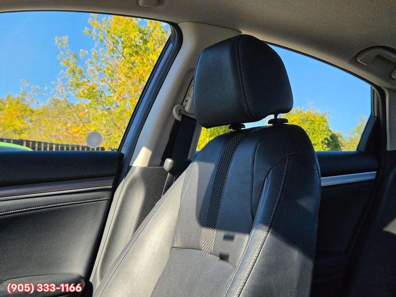 2019 Honda Civic Touring Apple CarPlay & Android Auto • Power Sunroof • Leather Seating • Built-In Navigation System • Remote Start System Photo