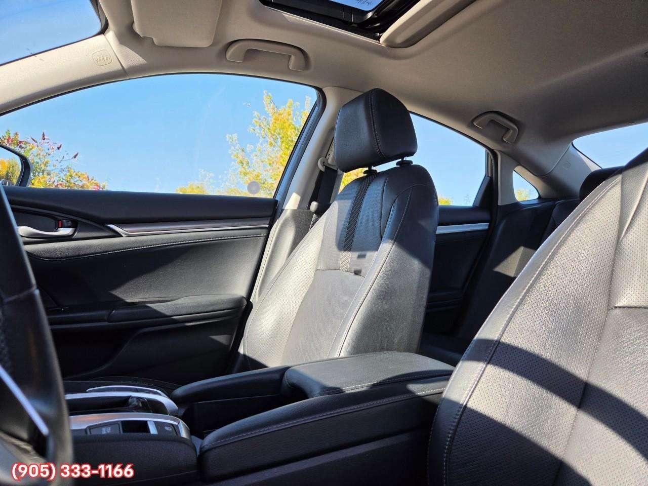 2019 Honda Civic Touring Apple CarPlay & Android Auto • Power Sunroof • Leather Seating • Built-In Navigation System • Remote Start System Photo