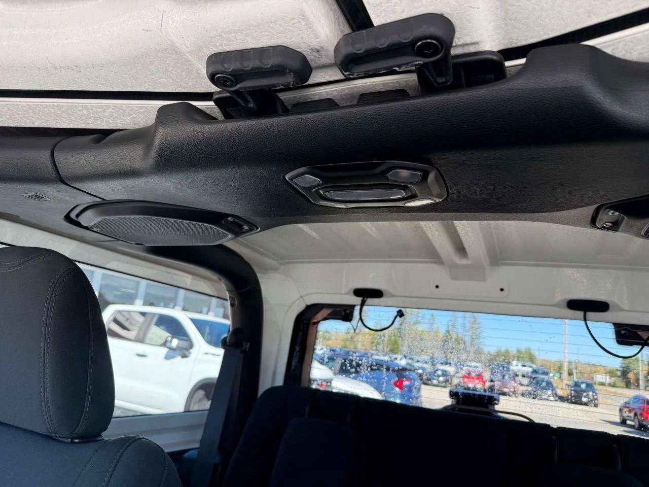 2022 Jeep Wrangler REMOVABLE TOP AND DOORS. 8 SPEAKER SOUND SYSTEM WITH OVERHEAD SOUND BAR. REAR BACK UP CAMERA. CERTIFIED. Photo