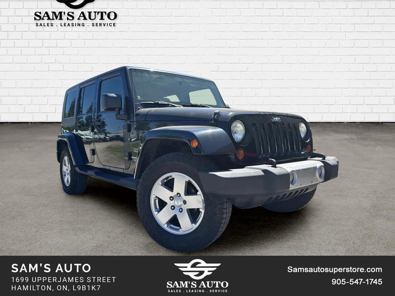 2010 Jeep Wrangler UNLIMITED 4WD 4DR SAHARA Photo
