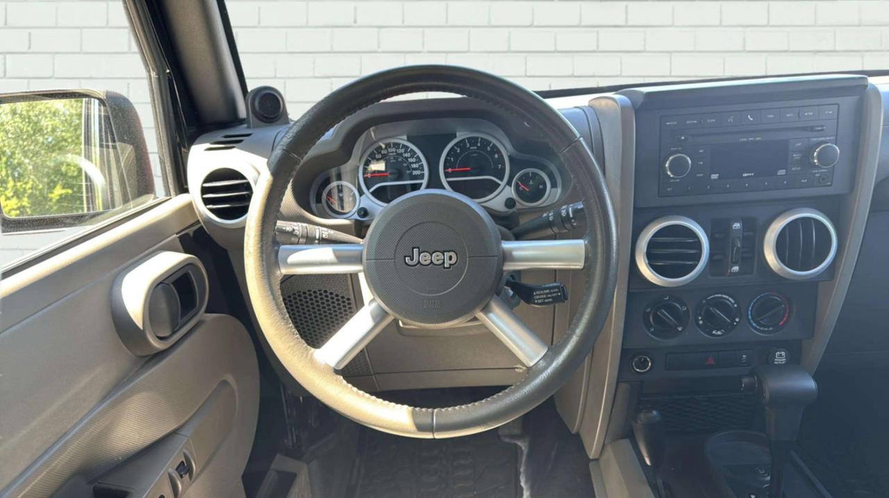 2010 Jeep Wrangler UNLIMITED 4WD 4DR SAHARA Photo