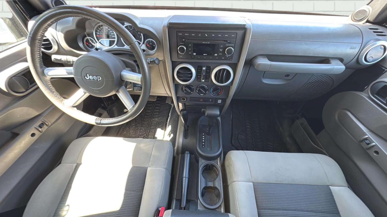 2010 Jeep Wrangler UNLIMITED 4WD 4DR SAHARA Photo