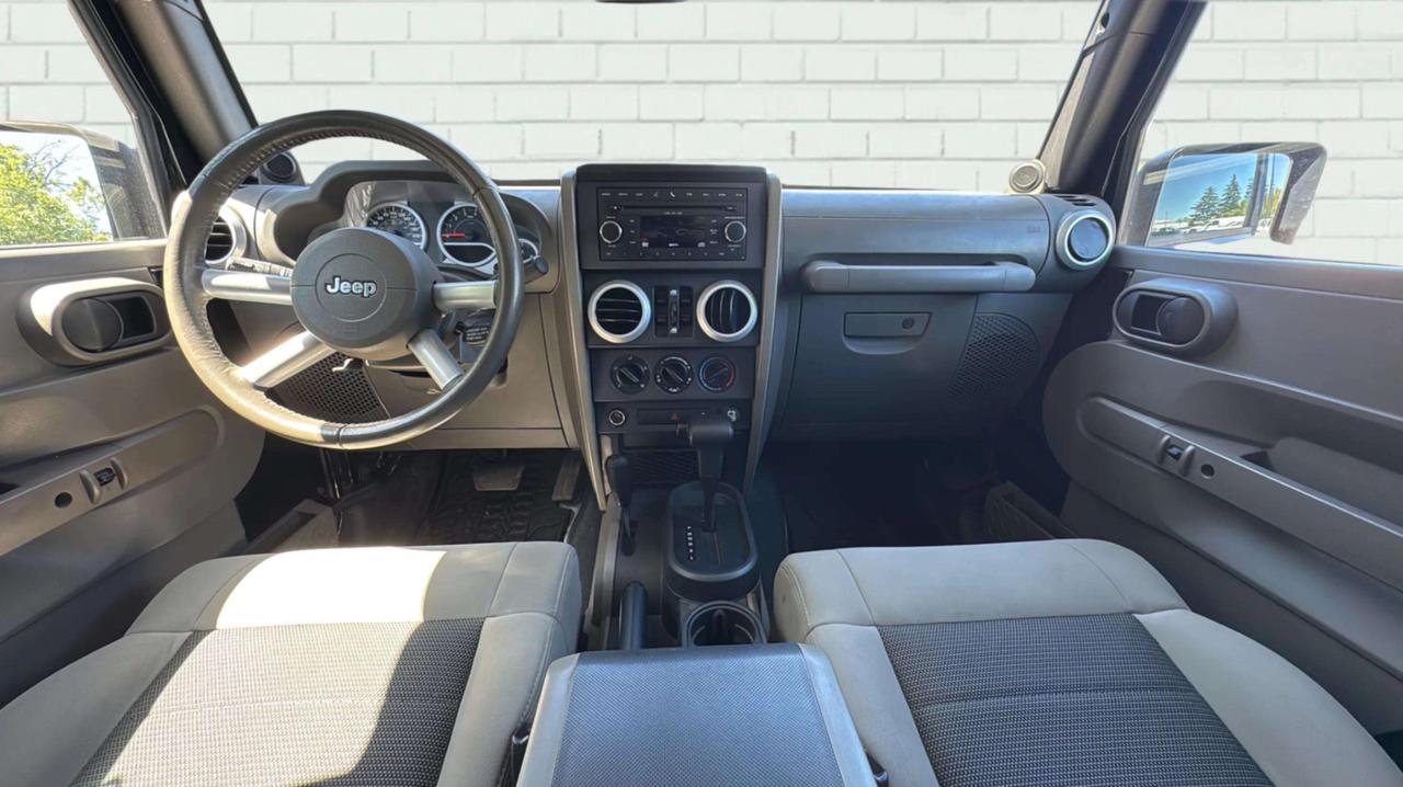 2010 Jeep Wrangler UNLIMITED 4WD 4DR SAHARA Photo
