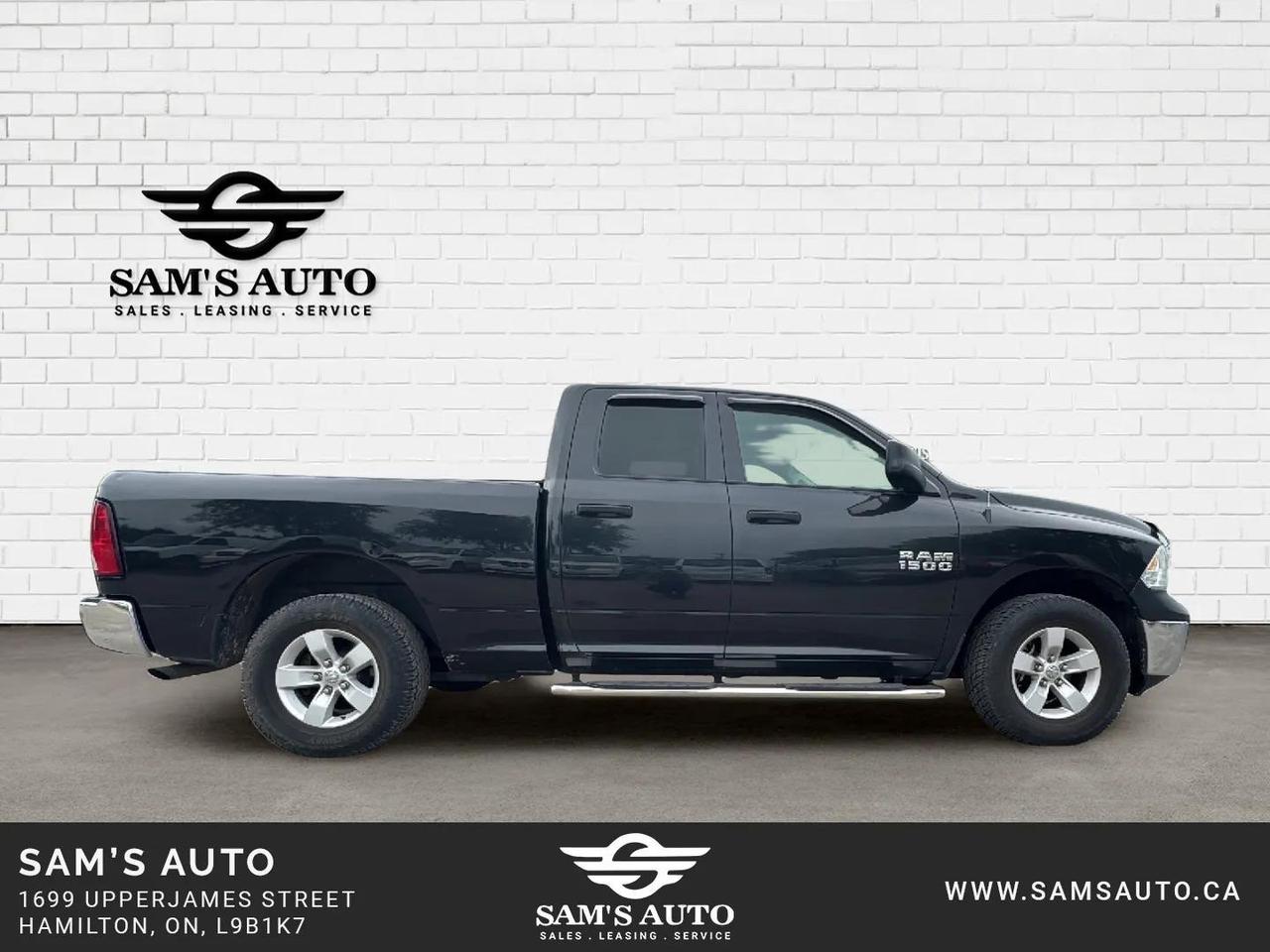 2017 RAM 1500 4WD QUAD CAB 140.5" ST Photo1