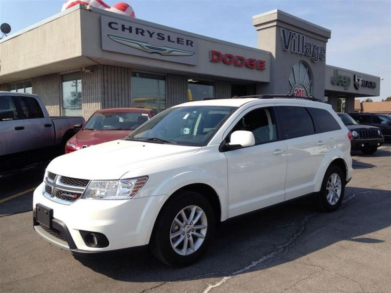 Treat yourself to a test drive in the 2014 Dodge Journey! A comfortable ride with plenty of style! All of the following features are included: front and rear reading lights, front dual-zone air conditioning, and 1-touch window functionality. Smooth gearshifts are achieved thanks to the 2.4 liter 4 cylinder engine, and for added security, dynamic Stability Control supplements the drivetrain. We pride ourselves on providing excellent customer service. Stop by our dealership or give us a call for more information.