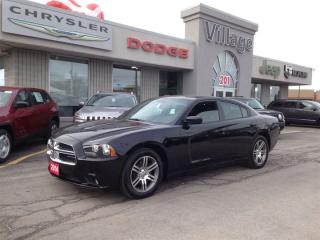 Treat yourself to a test drive in the 2014 Dodge Charger! This is an excellent vehicle at an affordable price! This 4 door, 5 passenger sedan just recently passed the 30,000 kilometer mark! Top features include heated front seats, speed sensitive wipers, front fog lights, and a split folding rear seat. Smooth gearshifts are achieved thanks to the refined 6 cylinder engine, and for added security, dynamic Stability Control supplements the drivetrain. Our experienced sales staff is eager to share its knowledge and enthusiasm with you. Wed be happy to answer any questions that you may have. Stop by our dealership or give us a call for more information.