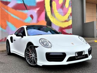 <p>2018 PORSCHE 911 TURBO | 3.8L FLAT 6 580HP | AWD | HEATED AND VENTED SEATS | PORSCHE ENTRY&DRIVE | POWER STEERING PLUS | LIGHT DESIGN PACKAGE | BURMESTER HIGH END SURROUND SOUND | CARBON CERAMIC BRAKES | HEADLIGHT CLEANIGN SYSTEM | ADAPTIVE CRUISE CONTROL | PORSCHE ACTIVE SAFE | LANE CHANGE ASSIST | FRONT AXLE LIFT | AEROKIT TURBP | PORSCHE LED DYNAMIC LIGHTS (PDLS PLUS) | LOCAL ONTARIO VEHICLE | <br />The Porsche 911 Carrera Turbo possesses an aggressive yet classy appearance with a white Matt exterior contrasted with a Carrera Red Leather interior and Black Leather dash. The metalic silver trim pieces on the dash and doors will also remind you that this is the Turbo  model. The Exterior is also enhanced with 20-inch 911 Turbo Wheels. Porsche also fits the Ceramic Composite Brake (PCCB) as a standard option on the Turbo  model.<br /><br />Youll love the driving experience. Porsches AWD Model with a rear engine layout makes this an absolute beast yet refined with every steering wheel movement. With a 3.8L Flat 6 (Boxer Motor) Twin-Turbocharged engine making 580 HP mated to the quick shifting PDK transmission is an incredible combination! That power with the AWD System will make sure that you will be in control of the car. The PDK and AWD as well as the 580HP engine will accelerate this car to 60mph in just 2.8 Seconds. The car also comes standard with Porsche Dynamic Chassis Control (PDCC) active roll stabilization system for the best cornering performance. Porsche claims its PDCC technology enhances cornering performance by keeping the tires in their optimal position at all times, while minimizing body roll.</p><br><p>OPEN 7 DAYS A WEEK. FOR MORE DETAILS PLEASE CONTACT OUR SALES DEPARTMENT</p>
<p>905-874-9494 / 1 833-503-0010 AND BOOK AN APPOINTMENT FOR VIEWING AND TEST DRIVE!!!</p>
<p>BUY WITH CONFIDENCE. ALL VEHICLES COME WITH HISTORY REPORTS. WARRANTIES AVAILABLE. TRADES WELCOME!!!</p>