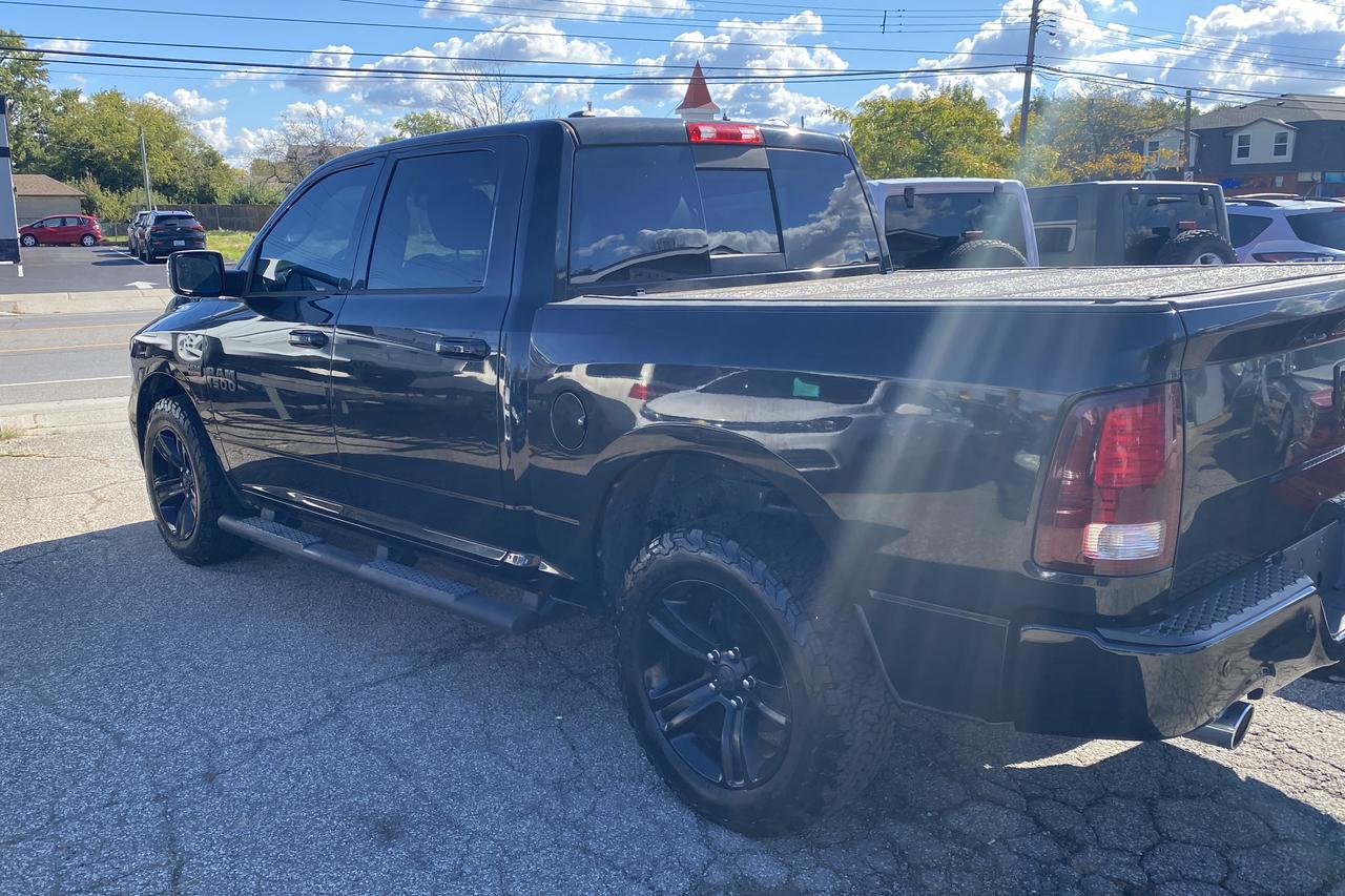 2016 RAM 1500 4WD Crew Cab 140.5" Sport Photo2