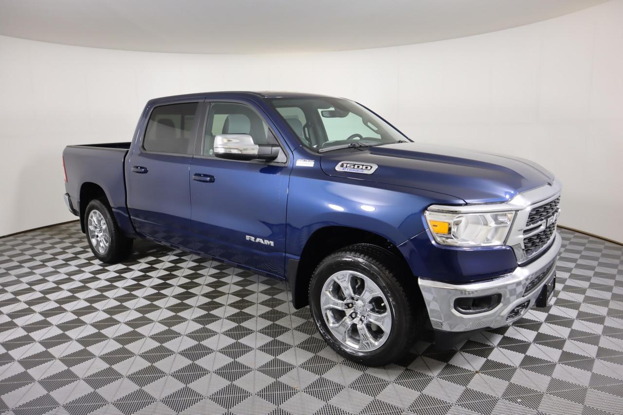 Youll be at the top of your game in our 2022 RAM 1500 Big Horn Crew Cab 4X4 showcased in Blue! Motivated by a 3.6 Litre Pentastar V6 supplying 305hp connected to an 8 Speed Automatic transmission so you can tow or haul without breaking a sweat. Equipped with eTorque mild-hybrid technology, this trail-friendly Four Wheel Drive truck achieves approximately 9.8L/100km on the highway and takes command of every challenge while showcasing quad halogen headlights, fog lamps, a chrome grille, alloy wheels, and bright bumpers.

Blending comfort and utility, our Big Horn cabin serves you well with supportive seats, a multifunction steering wheel, air conditioning, power accessories, and convenient Uconnect 3 infotainment technology that includes a touchscreen, Bluetooth, voice recognition, and a six-speaker audio system for your favorite tunes or talk. The smart layout keeps you fresh during long days, too!

RAM provides peace of mind with a high-strength steel frame, robust side-impact door beams, a backup camera, electronic stability control, tire-pressure monitoring, and trailer-sway damping. Turn heads with our fantastic 1500 thats one of the most awarded trucks on the road. Save this Page and Call for Availability. We Know You Will Enjoy Your Test Drive Towards Ownership!