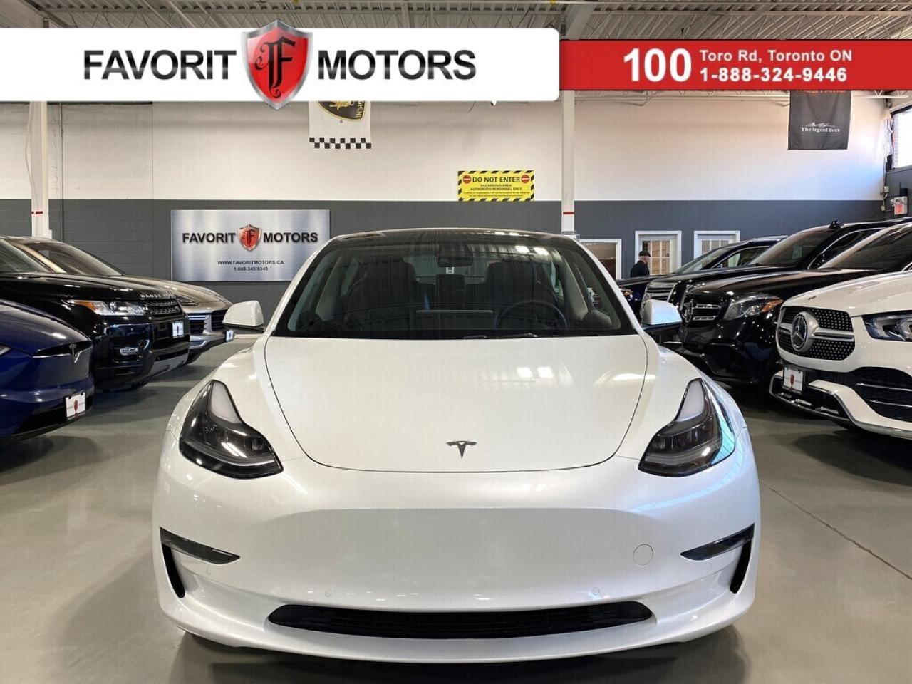**SUMMER SPECIAL!** FEATURING : DUAL PHONE WIRELESS CHARGING! ADVANCED AIR BAGS! AUTOPILOT! FULL SELF DRIVING COMPUTER! AUTOSTEER (BETA)! LIKE-NEW ONLY 3732 KMS! HIGHLY EQUIPPED, EXTREMELY CLEAN! FINISHED IN WHITE ON MATCHING BLACK INTERIOR, STITCHED VEGAN LEATHER SEATS, WOOD GRAIN INTERIOR TRIMS, HEATED SEATS, REAR HEATED SEATS, HEATED STEERING WHEEL, NAVIGATION SYSTEM, MULTI VIEW BACKUP CAMERA, PARKING SENSORS, BLIND SPOT COLLISION WARNING, FORWARD COLLISION WARNING, LANE DEPARTURE AVOIDANCE, AUTOMATIC EMERGENCY BRAKING, OBSTACLE-AWARE ACCELERATION, TRAFFIC AWARE CRUISE CONTROL, AM, FM, SPOTIFY, CARAOKE, TUNEIN, TIDAL, ARCADE, TOYBOX, NETFLIX, YOUTUBE, TWITCH, WEBBROWSER, HUBCAPS AND ALLOYS, BLUETOOTH WITH MEDIA STREAMING, STEERING WHEEL CONTROLS, PREMIUM HIFI SOUND SYSTEM, ALL POWER OPTIONS, DUAL TRUNK, DUAL PANORAMIC SUNROOF, AND MUCH MORE!!!

**As per OMVIC regulations, this vehicle is not drivable, not certified and not e-tested. Certification is available for $899.** All our vehicles are in excellent condition and have been fully inspected by an in-house licensed mechanic.

The advertised price is a finance only price, if you wish to purchase the vehicle for cash additional $2,000 surcharge will apply. Applicable prices and special offers are subject to change with or without notice and shall be at the full discretion of Favorit Motors.