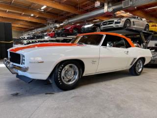 Show condition, 1969 Chevrolet Camaro RS/SS Convertible. Numbers matching car with 1,950 Miles Shown (5 Digit ODO). Professional appraisal done in 2018, valued at $178,350 CAD. Equipped with Orange vinyl / houndstooth trim, Glovebox mounted pioneer deck, Aux input, Usb input, Bluetooth, Upgraded component speakers, Power windows, Hurst shifter, Wood interior trim, Power steering, Power orange convertible top, Camaro SS equipment, Rally sport equipment, Air spoiler equipment, Special ducted hood, Hotchkis suspension components, 14 Rally wheels. 350ci stroked to 383ci V8 mated to a 4 speed manual transmission. Binder full of receipts for work done and parts replaced. 1 year warranty is included in the purchase price of this vehicle. Well maintained and just serviced. Leasing and financing available. All trades accepted. 
 
 Viewing by appointment 
 Dealer # 10290 null