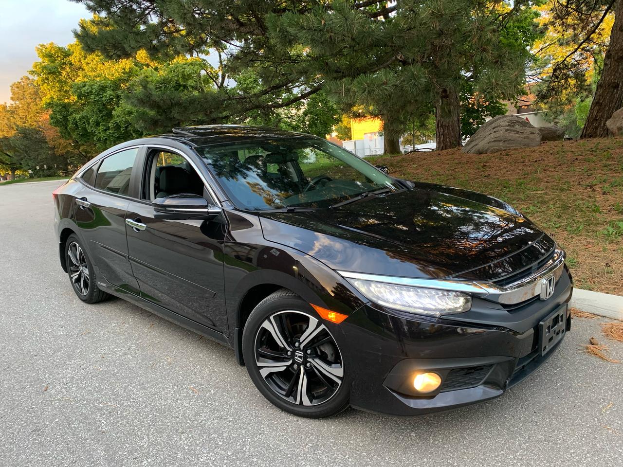 <p><em><strong>2016 HONDA CIVIC TOURING-ONLY 43,144 KMS.!!!&nbsp; YES,.....ONLY 43,144 KMS.!!!&nbsp; NOT A MISPRINT!!</strong></em></p><p><em><strong>LOCAL VEHICLE - NON SMOKER!</strong></em></p><p><em><strong>CLICK ON LINK BELOW TO VIEW FREE CARFAX HISTORY REPORT AND HONDA DEALER SERVICE HISTORY.</strong></em></p><p><span style=color: #0000ee;><strong><em><u>https://vhr.carfax.ca/?id=kfSqWM8Jh8boPlDwo7xEKNKwlrqkyWo6</u></em></strong></span></p><p>2016 HONDA CIVIC TOURING - FULLY LOADED- ALL OPTIONS</p><p>METICULOUSLY MAINTAINED EXCLUSIVELY AT HONDA DEALER (SEE CARFAX VEHICLE REPORT)</p><p><em><strong>2016 HONDA CIVIC TOURING - FULLY EQUIPPED*** GPS/NAVIGATION. LANE KEEPING ASSIST SYSTEM (LKAS),&nbsp; ADAPTIVE CRUISE CONTROL, BACK-UP CAMERA/SENSORS, POWER </strong></em><em><strong>GLASS MOONROOF,&nbsp; COLLISION MITIGATION BRAKING SYSTEM (CMBS), ROAD DEPARTURE MITIGATION (RDM),&nbsp; REMOTE ENGINE STARTER, CRUISE CONTROL, CELL PHONE CHARGING STATION, </strong></em>POWER HEATED LEATHER SEATS (***BOTH***FRONT AND SEATS!!), PROXIMITY/KEYLESS ENTRY, DUAL CLIMATE CONTROL. ALLOYS WHEELS, CRUISE CONTROL, PROTECTIVE FILM ON FRONT HOOD, WINTER/SUMMER MATS/CAPETS, PW, PM, PS, PB, ABS,....TOO MANY OPTIONS TO LIST!!!</p><p><span style=text-decoration: underline;><em><strong>THE ALL-IN SELLING PRICE INCLUDES THE FOLLOWING LISTED BELOW:</strong></em></span></p><p>CARFAX VEHICLE HISTORY REPORT&nbsp;</p><p>https://vhr.carfax.ca/?id=kfSqWM8Jh8boPlDwo7xEKNKwlrqkyWo6</p><p><br>*****SAFETY CERTIFICATION!!!<br><br>*****NATION-WIDE WARRANTY INCLUDED-BOTH PARTS AND LABOUR- VALID IN CANADA AND THE UNITED STATES</p><p>*****COMPLETE 100 POINT INSPECTION INCLUDING SYNTHETIC OIL AND FILTER CHANGE, TOP UP ALL FLUIDS, AND COMPLETE VEHICLE INSPECTION.&nbsp;</p><p>*****COMPLETE PROFESSONAL DETAIL/INTERIOR AND EXTERIOR CAR CLEAN-UP INCLUDING WASH/WAX/POLISH/LEATHER CONDITIONER/ENGINE SHAMPOO AND DE-GREASE AND FINALLY WHEELS POLISHED.<br><br>ONLY HST, LICENCE FEE & OMVIC FEE ($10.00) EXTRA.<br><br>NO OTHER (HIDDEN) FEES EVER!<br><br><em><strong>PLEASE CALL 416-274-AUTO (2886) TO SCHEDULE AN APPOINTMENT AND TO ENSURE VEHICLE AVAILABILITY.</strong></em><br><br><em><strong>R</strong><strong>ICHSTONE FINE CARS INC.</strong></em><br><em><strong>855 ALNESS STREET, UNIT 17</strong></em><br><em><strong>TORONTO, ONTARIO</strong></em><br><em><strong>M3J 2X3</strong></em></p><p><em><strong>416-274-AUTO (2886)</strong></em></p><p>WE ARE AN OMVIC CERTIFIED DEALER AND PROUD MEMBER OF THE UCDA.<br><br><em><strong>SERVING TORONTO/GTA & CANADA WIDE SALES SINCE 2000!!</strong></em></p><p><span style=text-decoration: underline;>2016 HONDA CIVIC TOURING - FULLY LOADED-OPTIONS BELOW!!!</span></p><div>BACK UP CAMERA</div><div>AIR CONDITIONING (DUAL AIR)</div><div>PREMIUM SOUND SYSTEM-9 SPEAKERS!!</div><div>DRIVER ASSISTANCE-LANE DEPARTURE WARNING SYSTME</div><div>DRIVER ASSISTANCE-LANE KEEP ASSIST SYSTEM</div><div>POWER GLASS MOONROOF</div><div>PROXIMITY KEY-PUSH BUTTON START</div><div>FORWARD COLLISON WARNING</div><div>POWER HEATED LEATHER SEAT (BOTH-FRONT AND REAR SEATS)</div><div>GPS NAVIGATION</div><div>ALLOY WHEELS</div><div>FOG LIGHTS, HEADLIGHTS&nbsp;</div><div>RAIN SENSING VARIABLE INTERMITTANT WIPERS</div>