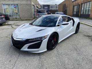 *BY APPOINTMENT ONLY*2017 Acura NSX, a Supercar with a Great Reputation !<br><br>AMAZING CONDITION, this 2017 Acura NSX comes with a 3.5L HYBRID TWIN TURBO V6 ENGINE that puts out 573 HORSEPOWER.<br><br>This Car is fully Specd <br><br>White Pearl Paint Upgrage Casino Pearl White $7800<br>Two Tone Black Red Interior Alcantara $1950<br>Alcantara Black Headliner $ $1700<br>Interwoven Wheels $ 2000<br>Carbon Ceramic Brakes with Red Calipers $13800<br>Carbon Fiber Interior Sport Package $3800<br>Carbon Fiber Exterior Sport Package $11700<br>Carbon Fiber Engine Bay $ 4700<br>Carbon Fiber Spoiler $ $3900<br>Carbon Fiber Roof $7800<br>Technology Package with XM Radio $4300<br><br>Well reviewed:  Were pleased to report that the NSXs advanced design doesnt detract from its mission. This is an exotic sports car that is easy to drive quickly every day. And it will accelerate to 60 mph in about 3.0 seconds while getting the fuel economy of what an Acura TL used to get back in the days of the old NSX. This organic driving experience in the face of its enormous complexity is probably the most striking accomplishment of the NSX,  (edumunds.com).<br><br> This is a precise, fast car that drives smaller and lighter than its curb weight suggests. The NSX is also a car that flatters its driver, whether a neophyte or an experienced shoe. Its tenacious traction as you power out of a corner as almost as surprising as the resolute faithfulness with which the NSXs nose follows the drivers steering input. In other words, the NSX goes exactly where you point it, and it exits corners as though attached to a centrifuge.<br><br>Forward visibility is outstanding. The NSXs low cowl and slim pillars help make it a terrific fast-road companion, since the driver can easily place the car on the road. And although the suspension delivers exemplary control, the damping is supple such that the ride quality is really quite comfortable even on bumpy pavement. Even the brake feel, which is commonly grabby and hard to modulate among hybrids, is so natural that you dont even think about it. This car could easily be driven daily despite its eye-opening pace on a back road,  (edumunds.com).<br><br>  ...the 2017 Acura NSX is a great used luxury sports car. This hybrid has rapid acceleration thanks to a potent turbocharged V6 engine and three electric motors. The NSX feels right at home zipping around corners or cruising local roads, with its sharp handling, smooth regenerative brakes, and refined transmission. The standard adaptive suspension adjusts to road conditions for optimal comfort,  (cars.usnews.com).<br><br> This Acura   s brawny powertrain produces lightning-fast acceleration. Thanks to the electric motors, launches from a stop are instant. The transmission shifts quickly and seamlessly, and the regenerative brakes are strong. The NSX also comes with Acura   s Integrated Dynamics System, which features four selectable driving modes     Quiet, Sport, Sport , and Track     to customize your driving experience,  (cars.usnews.com).<br><br>Comes complete with power locks, power windows, and keyless remote entry.<br><br>This car has safety included in the advertised price.<br><br>Please Note: HST and Licensing is an additional fee separate from the advertised price. <br><br>We have a strong confidence in our cars, if you want to have a car inspected, Vision Fine Cars welcomes it.<br>  <br>Certain Crypto-Currency accepted as payment, Charges will apply.