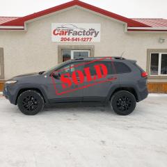 <p>*****SOLD*****</p><p> </p><p>This Jeep has every option available for Trailhawk , (It can even Parallel & Perpendicular park its self !) </p><p>Extremely Low Km, One Owner , Accident Free,  Heated and Cooled Seating, 4 Brand New Falken All Weather A/T tires </p><p class=MsoNormal>JEEP CHEROKEE TRAILHAWK 4X4</p><p class=MsoNormal>Exterior Color: Granite Crystal Metallic Interior Color: Black</p><p class=MsoNormal>Interior: Prem Leather Trimmed Bucket Seats</p><p class=MsoNormal>Customer Preferred Package 27E</p><p class=MsoNormal><strong><u>Safety Tec Group</u></strong></p><p class=MsoNormal>Blind Spot and Cross Path Detection</p><p class=MsoNormal><strong><u>Technology Group:</u></strong></p><p class=MsoNormal>Forward Collision Warning w/Active Braking Advanced Brake Assist</p><p class=MsoNormal>Rain Sensitive Windshield Wipers</p><p class=MsoNormal>Lane Sense Lane Departure Warning Plus Exterior Mirrors w/Supplemental Signals</p><p class=MsoNormal>Exterior Mirrors Courtesy Lamps</p><p class=MsoNormal>Auto High Beam Headlamp Control</p><p class=MsoNormal>Adaptive Cruise Control w/Stop & Go</p><p class=MsoNormal>Parallel & Perpendicular Park Assist</p><p class=MsoNormal><strong><u>Comfort/Convenience Group </u></strong></p><p class=MsoNormal>Tonneau Cover</p><p class=MsoNormal>Rear View Auto Dim Mirror w/Microphone</p><p class=MsoNormal>Passive Entry / Keyless Go</p><p class=MsoNormal>Remote Proximity Keyless Entry</p><p class=MsoNormal>Air Cond ATC w/Dual Zone Control</p><p class=MsoNormal>Premium Air Filter</p><p class=MsoNormal>Power 8−Way Driver Seat</p><p class=MsoNormal>Power 4−Way Driver Lumbar Adjust</p><p class=MsoNormal>Power Liftgate</p><p class=MsoNormal>Security Alarm</p><p class=MsoNormal>Remote Start System</p><p class=MsoNormal>Universal Garage Door Opener</p><p class=MsoNormal>Humidity Sensor</p><p class=MsoNormal><strong><u>Trailer Tow Group </u></strong></p><p class=MsoNormal>Jeep Off−Road Accessory Kit</p><p class=MsoNormal>3.517 Final Drive Ratio</p><p class=MsoNormal>Heavy Duty Engine Cooling</p><p class=MsoNormal>Trailer Tow Wiring Harness</p><p class=MsoNormal>7 and 4 Pin Wiring Harness</p><p class=MsoNormal>Class III Receiver Hitch</p><p class=MsoNormal><strong><u>Leather Interior Group </u></strong></p><p class=MsoNormal>Heated Front Seats</p><p class=MsoNormal>Heated Steering Wheel</p><p class=MsoNormal><strong><u>Ventilated/Memory Seat Group </u></strong></p><p class=MsoNormal>Prem Leather Trimmed Bucket Seats</p><p class=MsoNormal>Ventilated Front Seats</p><p class=MsoNormal>Power Multi−Function F/Away Mirrors</p><p class=MsoNormal>Exterior Mirrors w/Memory</p><p class=MsoNormal>Radio/Driver Seat/Exterior Mirrors Memory</p><p class=MsoNormal>Exterior Mirrors w/Heating Element</p><p class=MsoNormal><strong><u>3.2L Pentastar VVT V6 engine </u></strong></p><p class=MsoNormal>Engine Stop−Start System</p><p class=MsoNormal>3.251 Final Drive Ratio</p><p class=MsoNormal>Dual Bright Exhaust Tips</p><p class=MsoNormal><strong><u>Command View dual pane sunroof</u></strong></p><p class=MsoNormal>Black Hood Decal</p><p class=MsoNormal><strong><u>Uconnect 8.4AN AM/FM/SXM/BT/NAV </u></strong></p><p class=MsoNormal><strong><u>GPS Navigation</u></strong></p><p class=MsoNormal><strong><u>Nine amplified speakers & subwoofer</u></strong></p><p><strong><u><span style=font-size: 11.0pt; line-height: 107%; font-family: Calibri,sans-serif; mso-ascii-theme-font: minor-latin; mso-fareast-font-family: Calibri; mso-fareast-theme-font: minor-latin; mso-hansi-theme-font: minor-latin; mso-bidi-font-family: Times New Roman; mso-bidi-theme-font: minor-bidi; mso-ansi-language: EN-CA; mso-fareast-language: EN-US; mso-bidi-language: AR-SA;>17X7.5−inch black aluminum wheels</span></u></strong></p><p> </p><p>We offer on the spot financing; we finance all levels credit. </p><p>New Falken A/T tires All Weather tires over worth over $1200.00</p><p>Includes 90 day warranty plus Several Warranty Options Available,</p><p>All our vehicles come with a Manitoba safety.</p><p>Proud members of The Manitoba Used Car Dealer Association as well as the Manitoba Chamber of Commerce.</p><p>All payments, and prices, are plus applicable taxes. Dealers permit #4821</p>