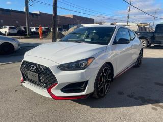 <p>One owner, no accident, clean title Hyundai Veloster N 2.0L Turbocharged 6-Speed Manual FWD in Chalk White.</p><p>The N badge signifies performance and a pure driving experience. With a 6-speed stick and 275 horsepower from the twin-scroll turbod 2.0L 4 banger, the Veloster N will push 15psi of boost to get you to 100 km/h in less than 5 seconds. The badge adds Brembo brakes, aerodynamics from the skirts, bumper vents, and wing/lip combo, third brake light for the track, and performance pages to track everything from Gs on corners and how quick you launch. </p><p>The hot-hatch is still well equipped for daily use, with heated seats, mirrors, and steering wheel, back-up camera, keyless entry, push-button start, and phone projection for both Apple and Android.</p><p>ABS brakes, Air Conditioning, Alloy wheels, AppLink/Apple CarPlay and Android Auto, Cloth Seating Surfaces, Exterior Parking Camera Rear, Fully automatic headlights, Heated door mirrors, Heated front seats, Outside temperature display, Power steering, Power windows, Radio: Infinity AM/FM/XM/MP3 Audio System, Rear window defroster, Remote keyless entry, Security system, Speed control, Split folding rear seat, Steering wheel mounted audio controls, Tilt & Telescoping steering wheel, Traction control, Variably intermittent wipers.</p>