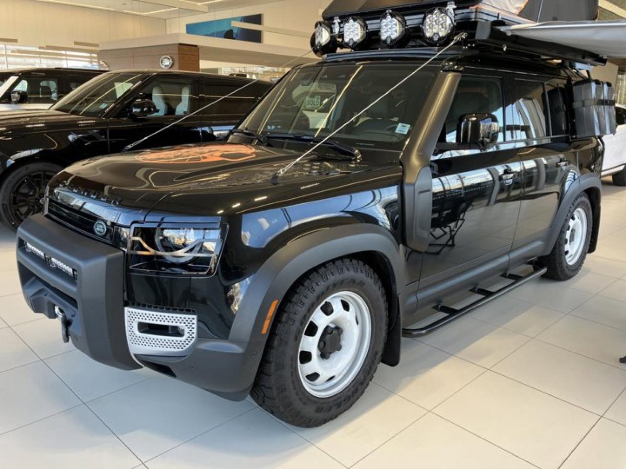 The 2023 Land Rover Defender S Trek Edition is a special model designed to offer an exciting blend of rugged off-road capability and refined on-road performance. This edition builds upon the iconic Defenders heritage, combining luxury with adventure-ready features. Heres a description of the vehicle:Exterior:The 2023 Defender S Trek Edition stands out with a unique, bold appearance.The vehicle is equipped with black accents on the grille, side vents, and door handles, emphasizing its adventurous spirit. The all-terrain wheels come with aggressive tires designed for superior grip, making it well-suited for off-road escapades.Interior:Inside, the Defender S Trek Edition offers a premium, utilitarian interior with high-end materials like grained leather upholstery and durable fabrics that can withstand the demands of off-road adventures. The cabin features plush seating with advanced ergonomics to ensure comfort during long journeys. The dashboard includes a 10-inch Pivi Pro touchscreen system, allowing for seamless connectivity and access to off-road navigation and vehicle settings.Performance:The 2023 Defender S Trek Edition is powered by a 2.0-liter turbocharged four-cylinder engine that delivers 296 horsepower and 295 lb-ft of torque, paired with an 8-speed automatic transmission. This powertrain ensures excellent performance both on and off the road. The vehicle comes with Land Rovers advanced Terrain Response system, allowing it to adapt to a variety of driving conditions, including mud, sand, and snow.Features:Adaptive cruise control and lane-keeping assist enhance comfort during highway driving.Electronic air suspension ensures a smooth and controlled ride, adjusting the vehicles height for off-road clearance.LED headlights and fog lights improve visibility during night or adverse weather conditions.The vehicle also includes a wireless charging pad, keyless entry, and a premium sound system, adding convenience and entertainment on all kinds of journeys.Off-Road Capability:As with all Defenders, the S Trek Edition offers legendary off-road performance. It comes equipped with air suspension, terrain response settings, and permanent all-wheel drive, allowing it to tackle even the most challenging landscapes. Whether youre exploring rugged trails, sandy dunes, or rocky paths, this edition is ready for any adventure.Safety:The Defender S Trek Edition is equipped with a suite of safety features, including blind-spot monitoring, rear cross-traffic alert, and 360-degree cameras for optimal visibility. Autonomous emergency braking and trailer stability assist ensure added safety for all occupants.In summary, the 2023 Land Rover Defender S Trek Edition combines luxury, advanced technology, and off-road prowess, making it an ideal choice for those seeking an adventure-ready vehicle with a sophisticated touch.