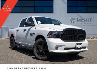 <p><strong><span style=font-family:Arial; font-size:16px;>Start your journey to a new car today with our unbeatable automotive dealership deals! Introducing the 2023 RAM 1500 Classic Tradesman, a pickup that embodies strength, luxury, and practicality..</span></strong></p> <p><strong><span style=font-family:Arial; font-size:16px;>This brand new vehicle, exquisitely finished in a pristine white exterior and a sophisticated grey interior, could be the car of your dreams..</span></strong> <br> This spectacular Tradesman model is equipped with a powerful 5.7L 8-Cyl engine and a smooth 8-speed automatic transmission that ensures optimal performance, reliability, and fuel efficiency.. With a plethora of options and features, this pickup is designed for utmost comfort and functionality.</p> <p><strong><span style=font-family:Arial; font-size:16px;>From traction control, ABS brakes, power windows, to air conditioning, you will find everything you need for a comfortable and safe drive..</span></strong> <br> The Tradesman trim boasts an array of sophisticated features such as a tachometer, compass, an AM/FM radio, and a trailer hitch receiver, which adds to its versatility and utility.. Safety is paramount in this pickup, with dual front impact airbags, dual front side impact airbags, electronic stability, and a low tire pressure warning system.</p> <p><strong><span style=font-family:Arial; font-size:16px;>This never driven vehicle showcases design and style with its heated door mirrors, fully automatic headlights, and a crew cab that provides ample space for you and your passengers..</span></strong> <br> The convenience does not end here; features such as 1-touch down, 1-touch up, front beverage holders, and speed control make your ride as smooth as possible.. At Langley Chrysler, we believe in the joy of buying, not just owning a car.</p> <p><strong><span style=font-family:Arial; font-size:16px;>Our motto, Dont just love your car, love buying it encapsulates our commitment to providing you with a seamless and enjoyable purchasing experience..</span></strong> <br> This 2023 RAM 1500 Classic Tradesman is not just a vehicle; it is a statement of style and a testament to quality.. It stands out from the competition because it offers the best of both worlds - the durability of a pickup and the luxury of a high-end car.</p> <p><strong><span style=font-family:Arial; font-size:16px;>It is a vehicle that caters to everyone, without making any assumptions about the buyer..</span></strong> <br> In the words of Mary Barra, I believe in the power of mobility...its about more than just cars and trucks; its about the freedom to live your life on your terms. Come in today and make this brand new, never driven pickup a part of your life.. You wont just love this car; youll love buying it too</p>.Documentation Fee $968, Finance Placement $628, Safety & Convenience Warranty $699

<p>*All prices are net of all manufacturer incentives and/or rebates and are subject to change by the manufacturer without notice. All prices plus applicable taxes, applicable environmental recovery charges, documentation of $599 and full tank of fuel surcharge of $76 if a full tank is chosen.<br />Other items available that are not included in the above price:<br />Tire & Rim Protection and Key fob insurance starting from $599<br />Service contracts (extended warranties) for up to 7 years and 200,000 kms starting from $599<br />Custom vehicle accessory packages, mudflaps and deflectors, tire and rim packages, lift kits, exhaust kits and tonneau covers, canopies and much more that can be added to your payment at time of purchase<br />Undercoating, rust modules, and full protection packages starting from $199<br />Flexible life, disability and critical illness insurances to protect portions of or the entire length of vehicle loan?im?im<br />Financing Fee of $500 when applicable<br />Prices shown are determined using the largest available rebates and incentives and may not qualify for special APR finance offers. See dealer for details. This is a limited time offer.</p>