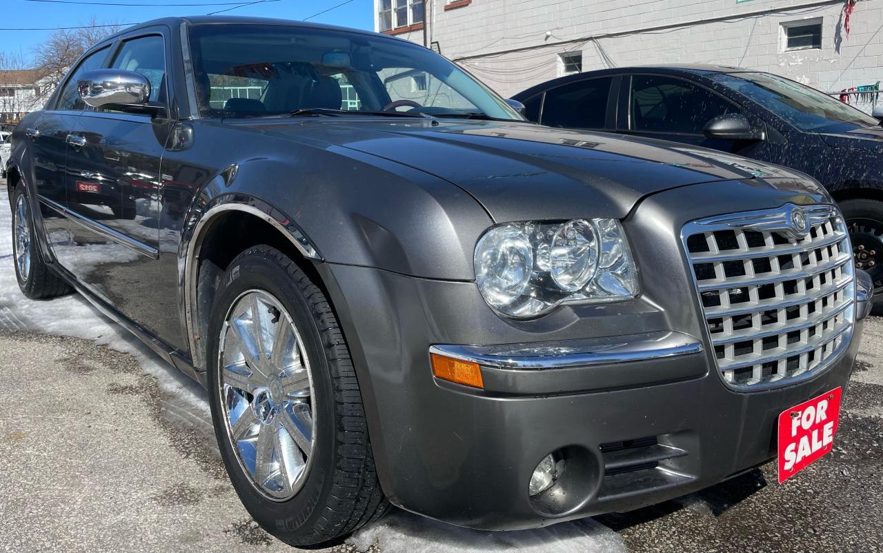 2009 Chrysler 300 Comes with sunroof, Leather seats, Cruise control, Heated seats, Bluetooth,Aux And Alloy wheels in this 300 Limited