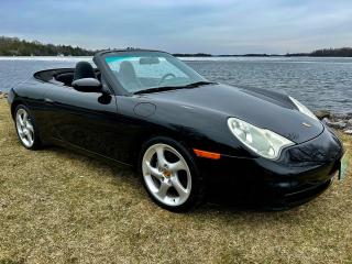 <p>Experience pure driving pleasure with the 2004 Porsche 911 Carrera (996) Coupe - a rare find with a 6-speed manual transmission. Embrace the thrill of open-air motoring with its convertible top, while exuding timeless elegance with its black exterior and luxurious black leather interior. With just 99,600 kilometers, this exceptional sports car promises an unforgettable journey that blends power, style, and precision in one captivating package. Dont pass up the chance to own this iconic classic that captures the true essence of driving excitement!</p><p>Features:<br />- 3.6L Engine ( V6 ) 6-Speed Manual Transmission<br />- Convertible cloth top ( automatic button to out and close ) <br />- Dual powered heated seats, Power mirrors, Power windows<br />- Bose sound system<br />- Xenon Headlamps<br />- Chrome Exhaust tips</p><p><br />Discover YOUR trusted local dealership with a 30-year history - Callan Motor. Say goodbye to hidden fees and find a straightforward, hassle-free, transparent buying experience. Visit us in Perth, Ontario, conveniently located on highway 7. Drop by or book an appointment to find a quality vehicle with ease. </p>