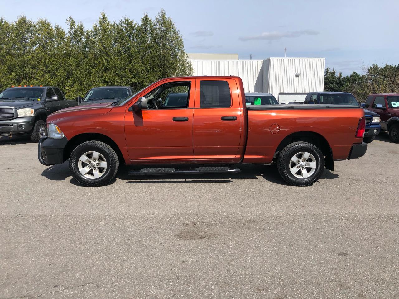 Used 2013 RAM 1500 4WD QUAD CAB 140.5