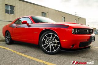 <p>The 2021 Dodge Challenger R/T is a high-performance muscle car that boasts a classic design and modern features. Its 5.7-liter Hemi V8 engine delivers up to 370+ horsepower and 400+ lb-ft of torque, making it a thrilling ride for enthusiasts. The interior is spacious and comfortable, with advanced technology including a 7-inch touchscreen display and Apple CarPlay/Android Auto compatibility.</p>
<p>Some Other Features Included:</p>
<p>Performance-tuned suspension ,Launch control, Active exhaust system, Rearview camera, Automatic headlights, Dual-zone automatic climate control, Leather-wrapped steering wheel, shift knob Bluetooth connectivity, Alpine audio system, Keyless entry and ignition, Power-adjustable drivers seat, 20-inch wheels and much more!!</p><br><p>OPEN 7 DAYS A WEEK. FOR MORE DETAILS PLEASE CONTACT OUR SALES DEPARTMENT</p>
<p>905-874-9494 / 1 833-503-0010 AND BOOK AN APPOINTMENT FOR VIEWING AND TEST DRIVE!!!</p>
<p>BUY WITH CONFIDENCE. ALL VEHICLES COME WITH HISTORY REPORTS. WARRANTIES AVAILABLE. TRADES WELCOME!!!</p>