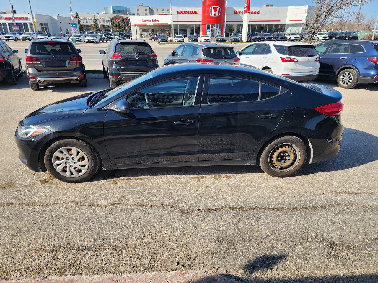 9873470