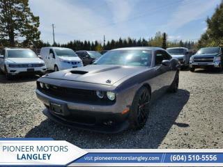 <b>Low Mileage, Android Auto,  Apple CarPlay,  Remote Start,  Park Assist,  Uconnect 4!</b><br> <br> At Pioneer Motors Langley, our team of professionals will guide you to make the right choice for your future vehicle. You will be advised as to the choice of the right vehicle and the best suitable financing for your needs. <br> <br> Compare at $69350 - Pioneer value price is just $67990! <br> <br>   Touting some of the most powerful muscle cars ever, the Dodge Challenger is an iconic, legendary name. This  2022 Dodge Challenger is fresh on our lot in Langley. <br> <br>The 2022 Dodge Challenger is really entering its golden age. With all the heritage of being one of the last pony cars in the 60s and 70s, and all the technology that the new iteration uses, the Dodge Challenger is certainly going to be remembered as a classic muscle car in the future. Own a piece of history in this powerful, practical, and iconic Dodge Challenger. This low mileage  coupe has just 1,500 kms. Its  nice in colour  and is completely accident free based on the <a href=https://vhr.carfax.ca/?id=BmTl532fjni+T/fzroccDH9uukF8A9q5 target=_blank>CARFAX Report</a> . It has a 6 speed manual transmission and is powered by a  375HP 5.7L 8 Cylinder Engine. <br> <br> Our Challengers trim level is R/T. This R/T steps up to a HEMI V8 for loud and proud power in true Dodge fashion. This R/T trim also upgrades your tech features with remote start and parking sensors while fog lamps provide style and safety. Uconnect 4 with Android Auto and Apple CarPlay makes your interior feel modern and fun. Remote keyless entry and rain sensing wipers provide convenience while aluminum wheels offer incredible style. A rear view camera makes sure you can see over that iconic trunk. This vehicle has been upgraded with the following features: Android Auto,  Apple Carplay,  Remote Start,  Park Assist,  Uconnect 4,  Remote Keyless Entry,  Aluminum Wheels. <br> To view the original window sticker for this vehicle view this <a href=http://www.chrysler.com/hostd/windowsticker/getWindowStickerPdf.do?vin=2C3CDZBT6NH104559 target=_blank>http://www.chrysler.com/hostd/windowsticker/getWindowStickerPdf.do?vin=2C3CDZBT6NH104559</a>. <br/><br> <br>To apply right now for financing use this link : <a href=https://www.pioneermotorslangley.com/finance/ target=_blank>https://www.pioneermotorslangley.com/finance/</a><br><br> <br/><br> Buy this vehicle now for the lowest bi-weekly payment of <b>$449.71</b> with $0 down for 96 months @ 7.99% APR O.A.C. ( Plus applicable taxes -  Plus applicable fees   / Total Obligation of $94535  ).  See dealer for details. <br> <br>Let us make your visit to our dealership as pleasant and rewarding as it can be. All pricing is plus $995 Documentation fee and applicable taxes. o~o