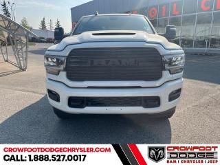 <b>Leather Seats, Sunroof, Night Edition, 5th Wheel Gooseneck Towing Prep Group!</b><br> <br> <br> <br>  This Ram 2500 is class-leader in the heavy-duty truck segment thanks to its refined interior, forgiving ride, and tremendous towing and hauling capabilities. <br> <br>Endlessly capable, this 2023 Ram 2500HD pulls out all the stops, and has the towing capacity that sets it apart from the competition. On top of its proven Ram toughness, this Ram 2500HD has an ultra-quiet cabin full of amazing tech features that help make your workday more enjoyable. Whether youre in the commercial sector or looking for serious recreational towing rig, this impressive 2500HD is ready for anything that you are.<br> <br> This pearl white sought after diesel Crew Cab 4X4 pickup   has an automatic transmission and is powered by a Cummins 370HP 6.7L Straight 6 Cylinder Engine.<br> <br> Our 2500s trim level is Laramie. This incredible Ram 2500 Laramie comes well equipped with class V towing equipment including a hitch, brake controller and trailer sway control, heavy duty suspension, heated and power adjustable side mirrors, front and reverse utility lights, cargo box lighting, and a rear step bumper. On the inside, occupants are treated to heated and power-adjustable front seats with lumbar support, leather upholstery, dual-zone front automatic air conditioning, a leather-wrapped steering wheel, and illuminated front cupholders. Stay connected on the road via an 8.4-inch display powered by Uconnect 5 with GPS navigation, HD radio, Apple CarPlay and Android Auto, Alexa Built-In, SiriusXM streaming radio, trailer tow pages, off-road info pages, and mobile hotspot internet access. Additional features include a 10-speaker Alpine audio system, 115-volt rear auxiliary power outlet, remote engine start, and even more! This vehicle has been upgraded with the following features: Leather Seats, Sunroof, Night Edition, 5th Wheel Gooseneck Towing Prep Group. <br><br> <br>To apply right now for financing use this link : <a href=https://www.crowfootdodgechrysler.com/tools/autoverify/finance.htm target=_blank>https://www.crowfootdodgechrysler.com/tools/autoverify/finance.htm</a><br><br> <br/> Total  cash rebate of $9450 is reflected in the price. Credit includes $9,450 Consumer Cash Discount. <br> Buy this vehicle now for the lowest bi-weekly payment of <b>$591.16</b> with $0 down for 96 months @ 6.49% APR O.A.C. ( Plus GST  documentation fee    / Total Obligation of $122961  ).  Incentives expire 2024-02-29.  See dealer for details. <br> <br>We pride ourselves in consistently exceeding our customers expectations. Please dont hesitate to give us a call.<br> Come by and check out our fleet of 80+ used cars and trucks and 180+ new cars and trucks for sale in Calgary.  o~o